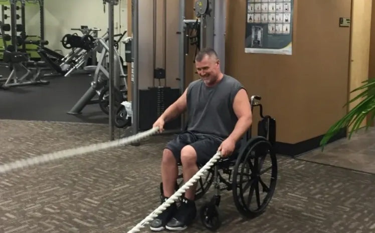 Stroke survivor Chris works hard at physical therapy after his stroke.