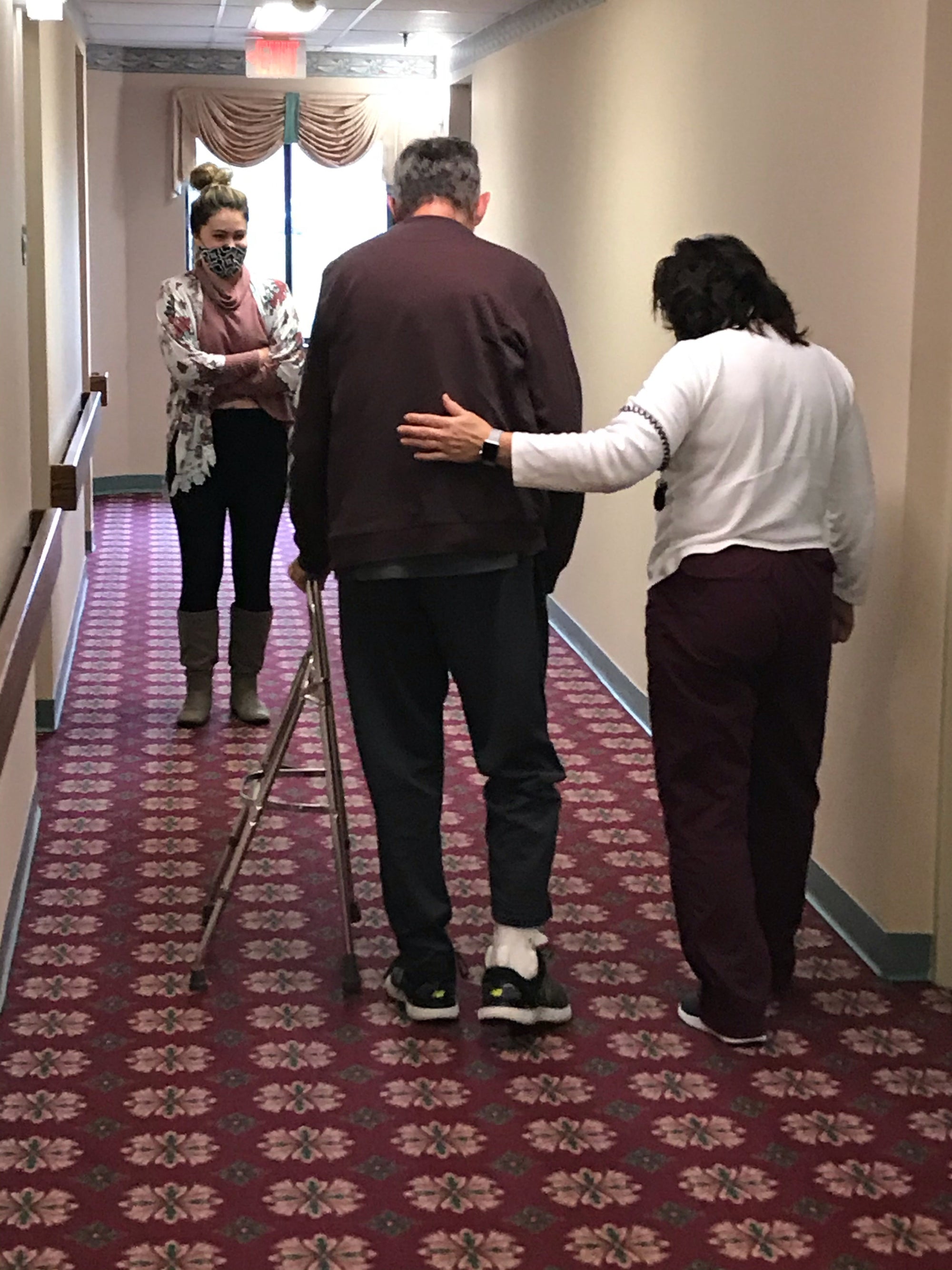 Uncle Andy practices walking with his therapist.