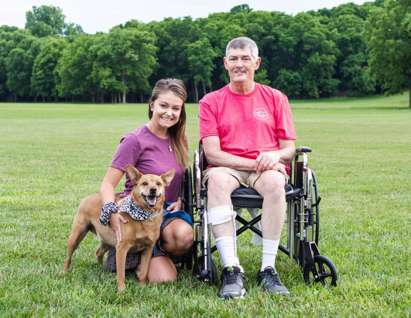 Uncle Andy poses with Sophie and his dog Alex. Together they have a small business that gives Andy joy and motivation while inspiring others. 